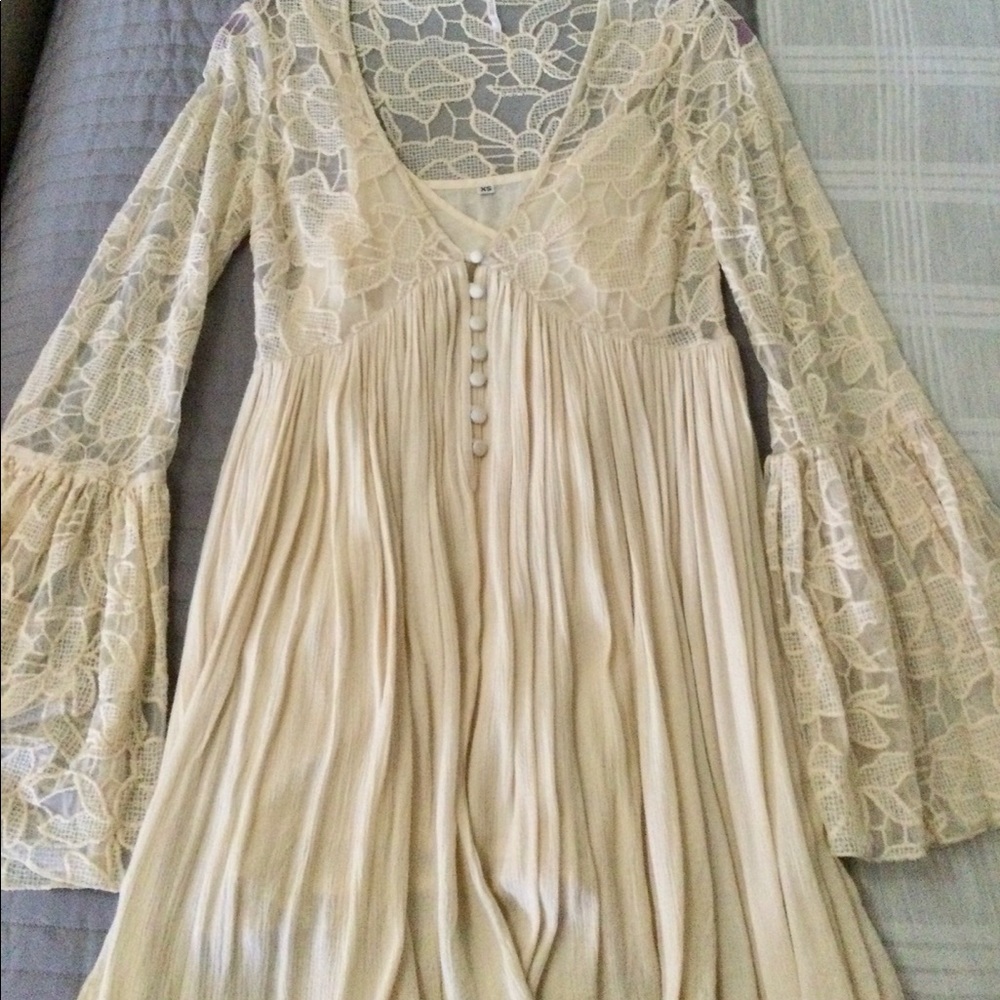 Free People mini dress with long lace bell sleeves.